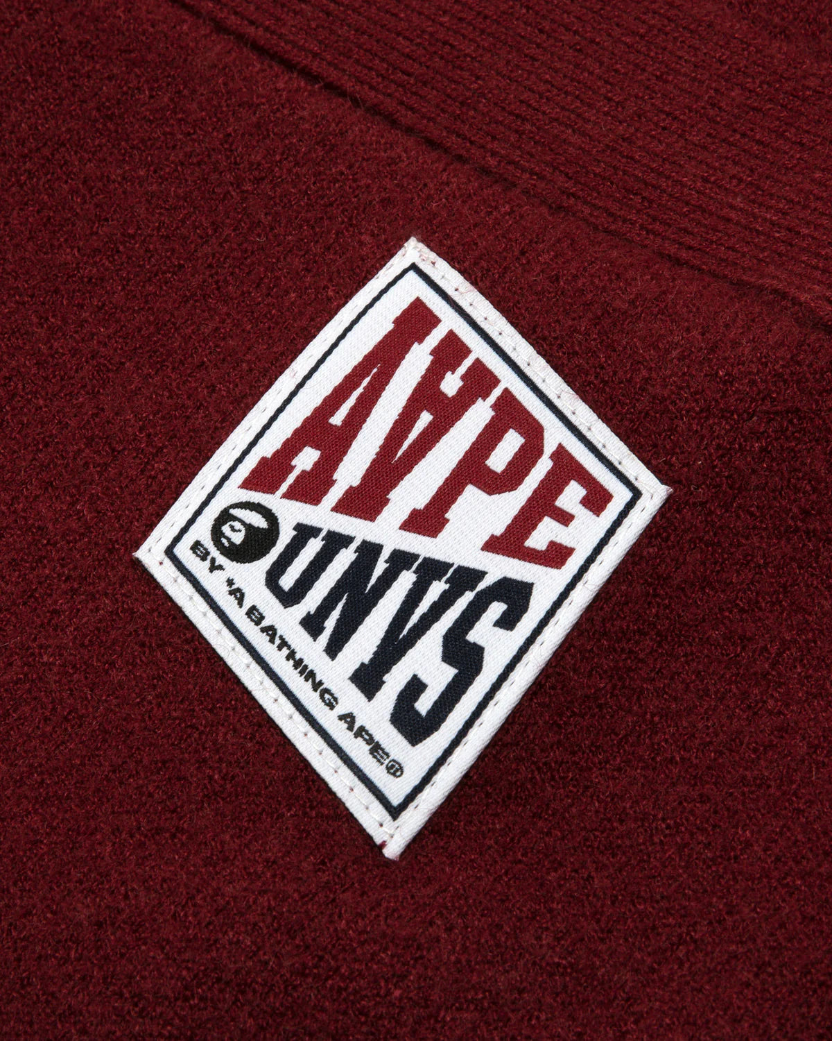 AAPE UNVS moonface logo hooded cardigan