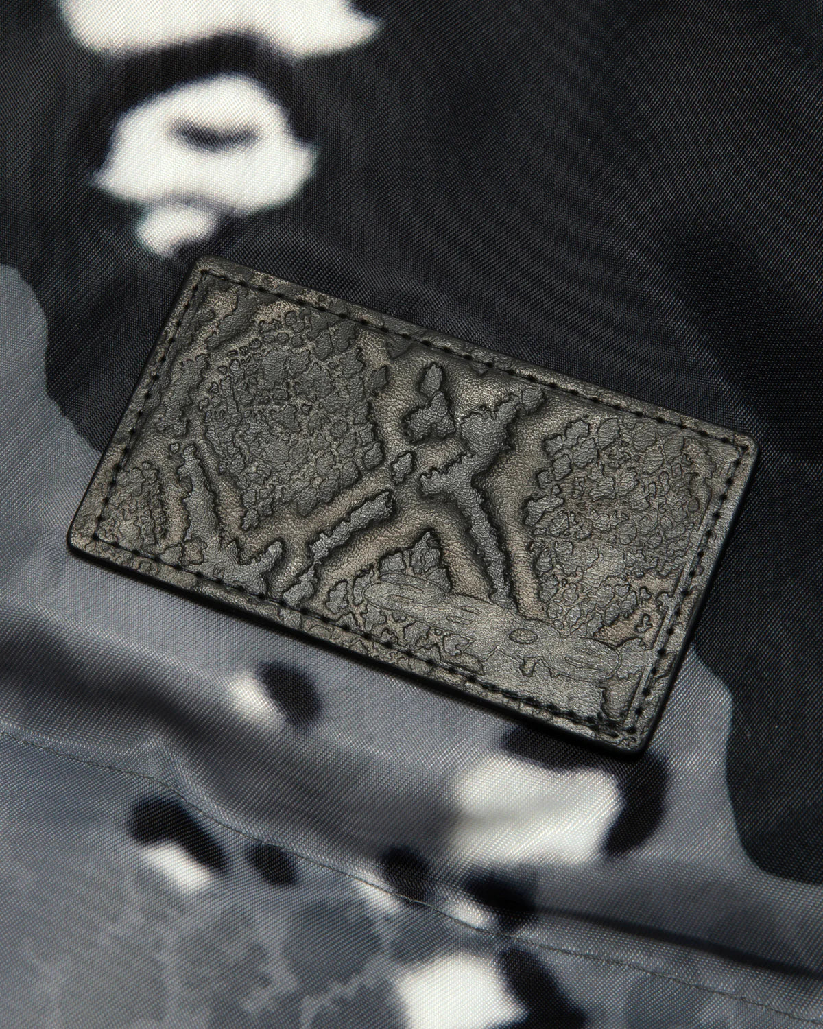 Moonface logo camo puffer jacket