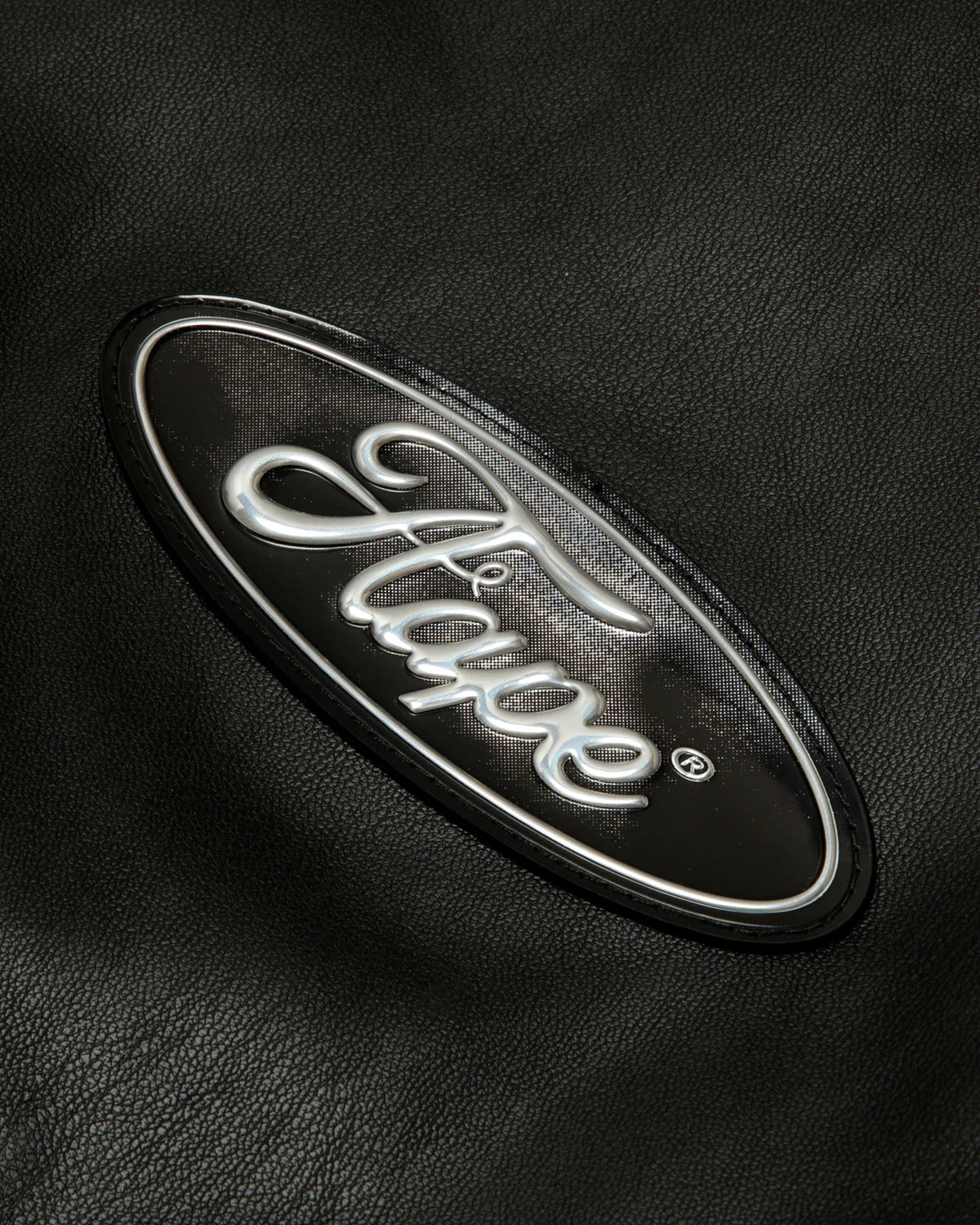 Moonface logo faux leather hooded jacket